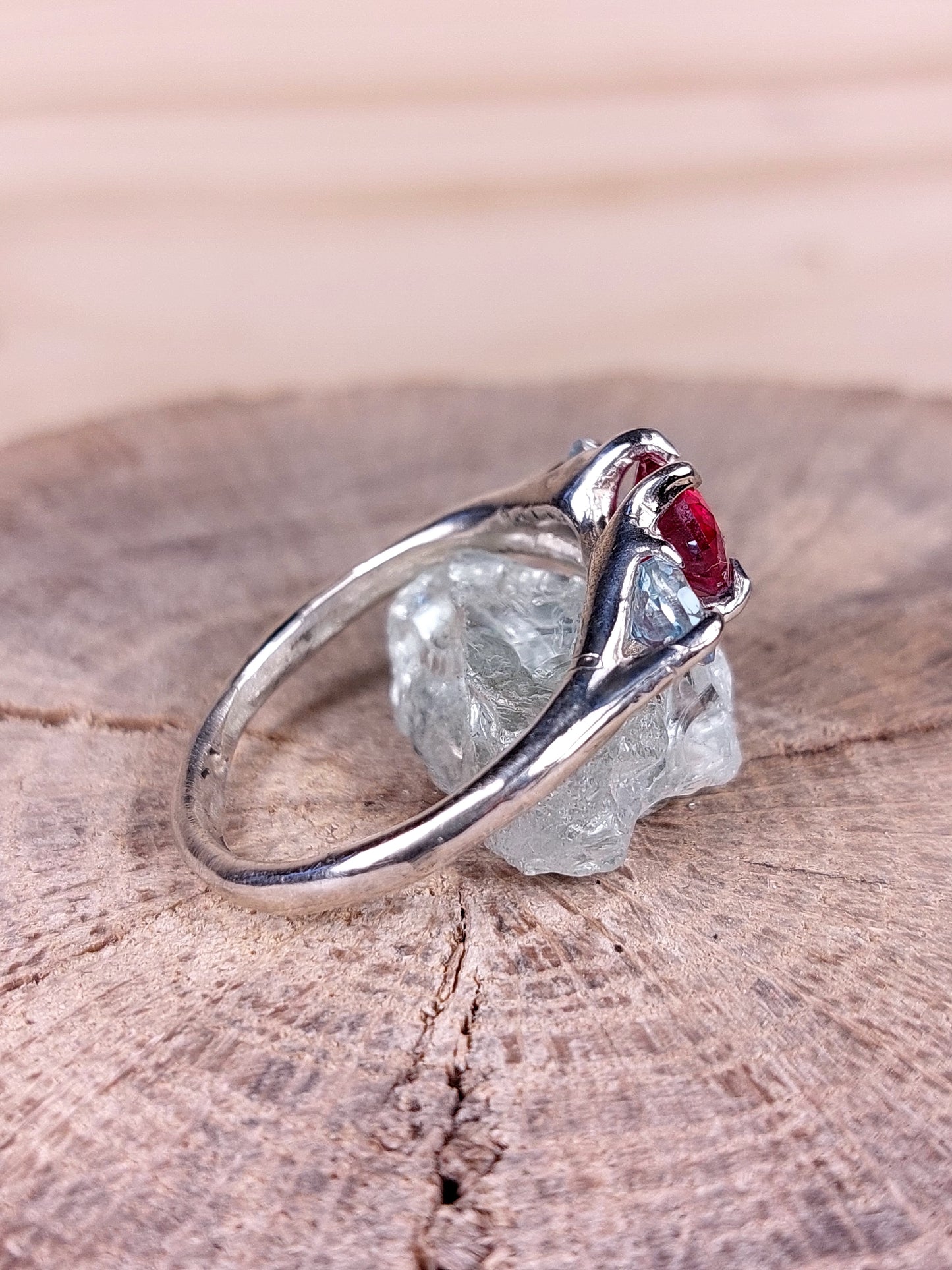 Trilogy "NeroCraft" with Ruby (synthetic) Heart cut and Sky Topazes