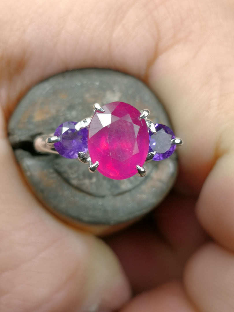Trilogy "NeroCraft" with natural oval cut treated Ruby and Amethysts