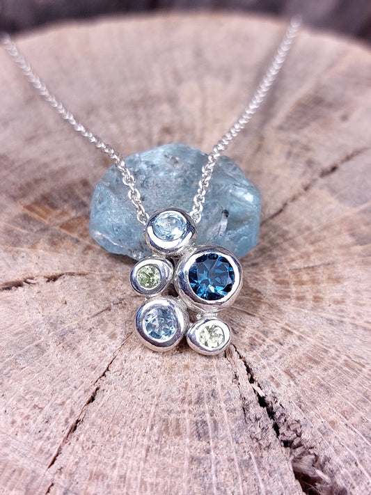 "Ciottoli" In argento con Topazio London, Topazi Sky e Peridoti