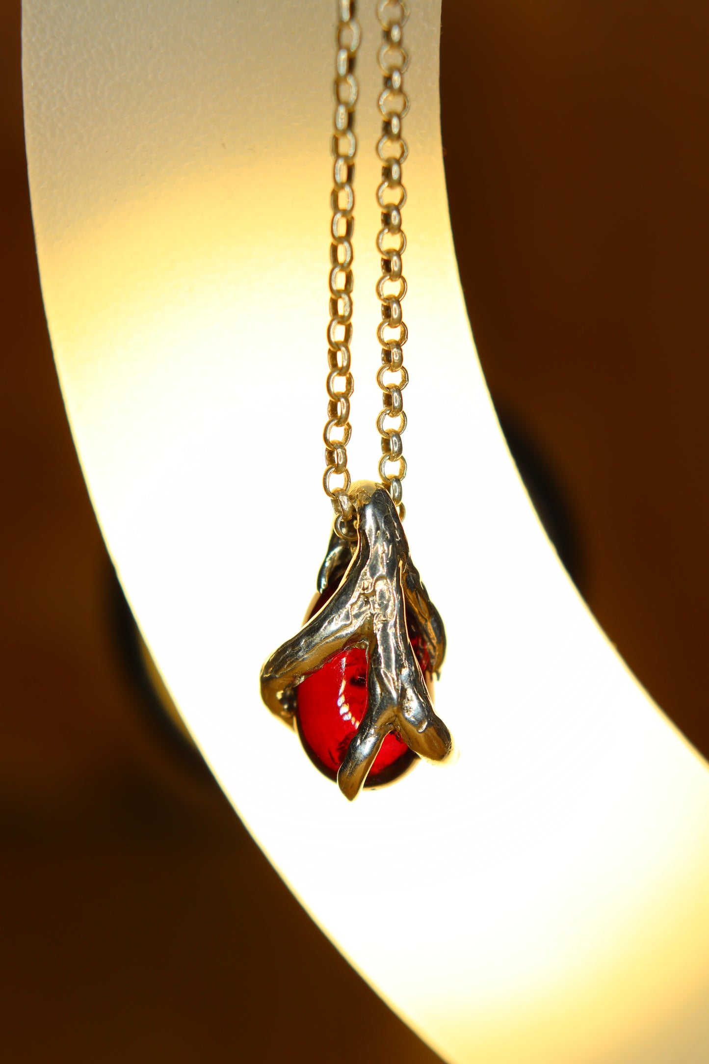 Ciondolo in argento con Ciottolo di Granato Piropo Burattato