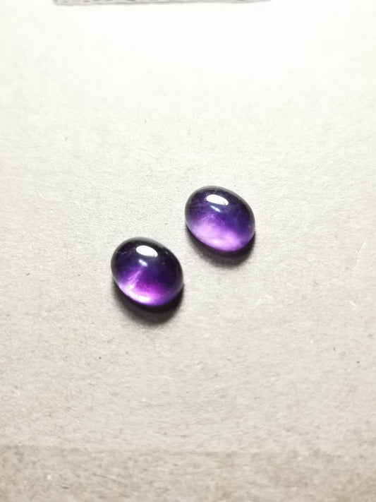 Coppia di Ametiste taglio ovale cabochon 6,43 ct totali