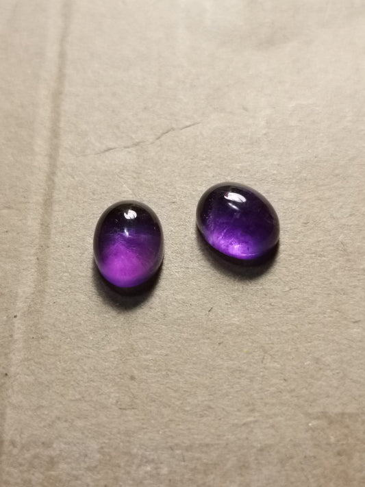 Coppia di Ametiste taglio ovale cabochon 6,70 ct totali