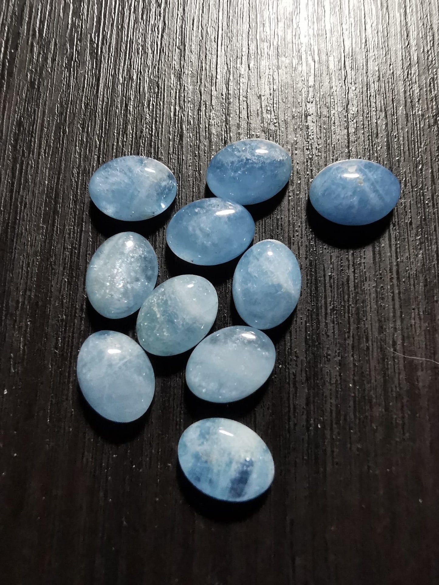 Lotto di dieci Acquamarine taglio ovale cabochon 13,23 ct