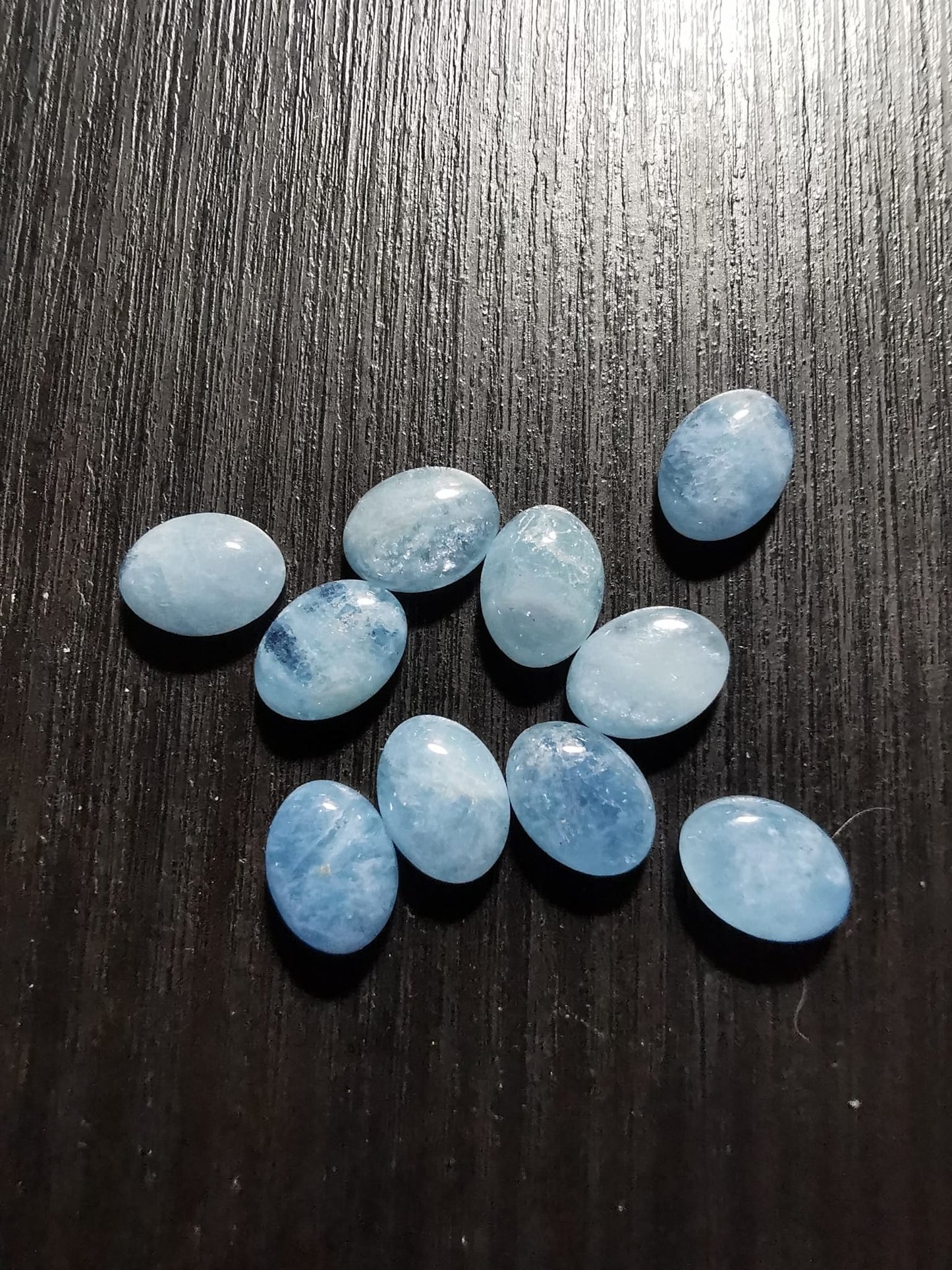 Lotto di dieci Acquamarine taglio ovale cabochon 13,23 ct