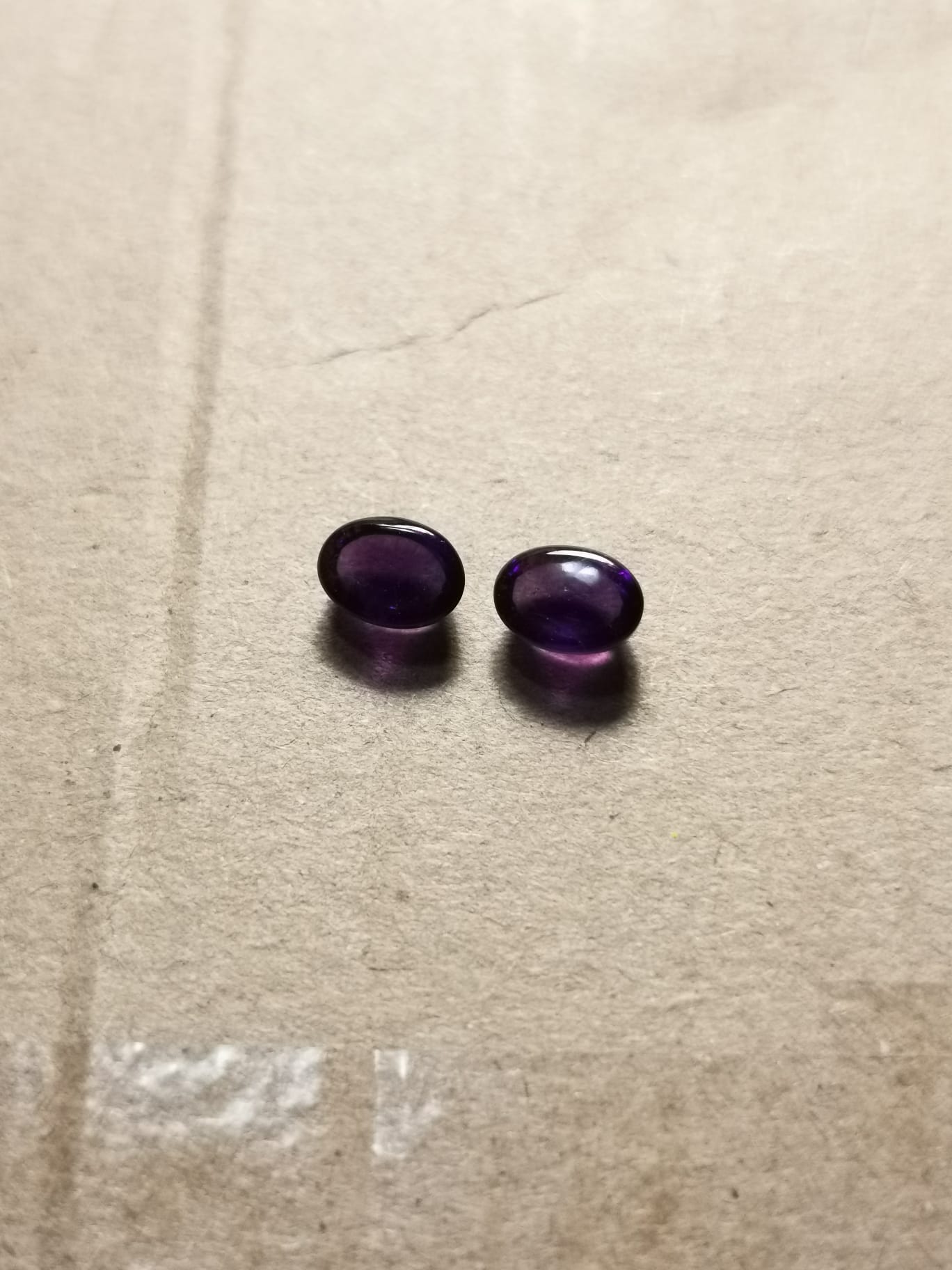 Coppia di Ametiste taglio ovale cabochon 1,89 ct totali