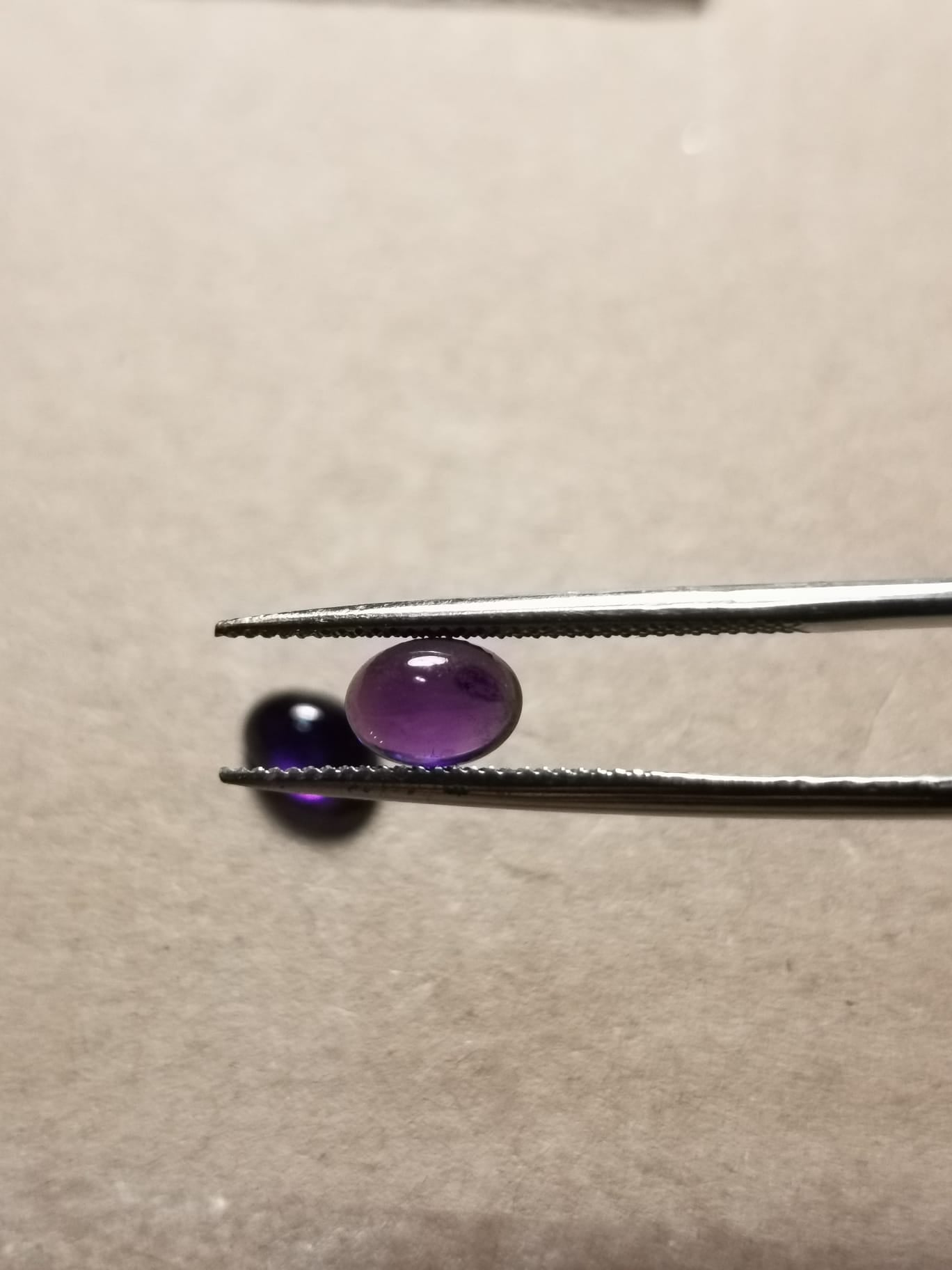 Coppia di Ametiste taglio ovale cabochon 1,87 ct totali